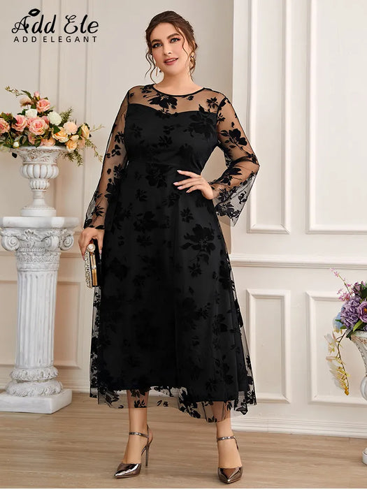 Plus size flower mesh covered black dress with flare sleeve.